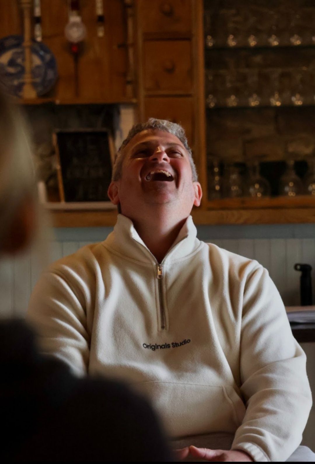 A man laughing during a group session
